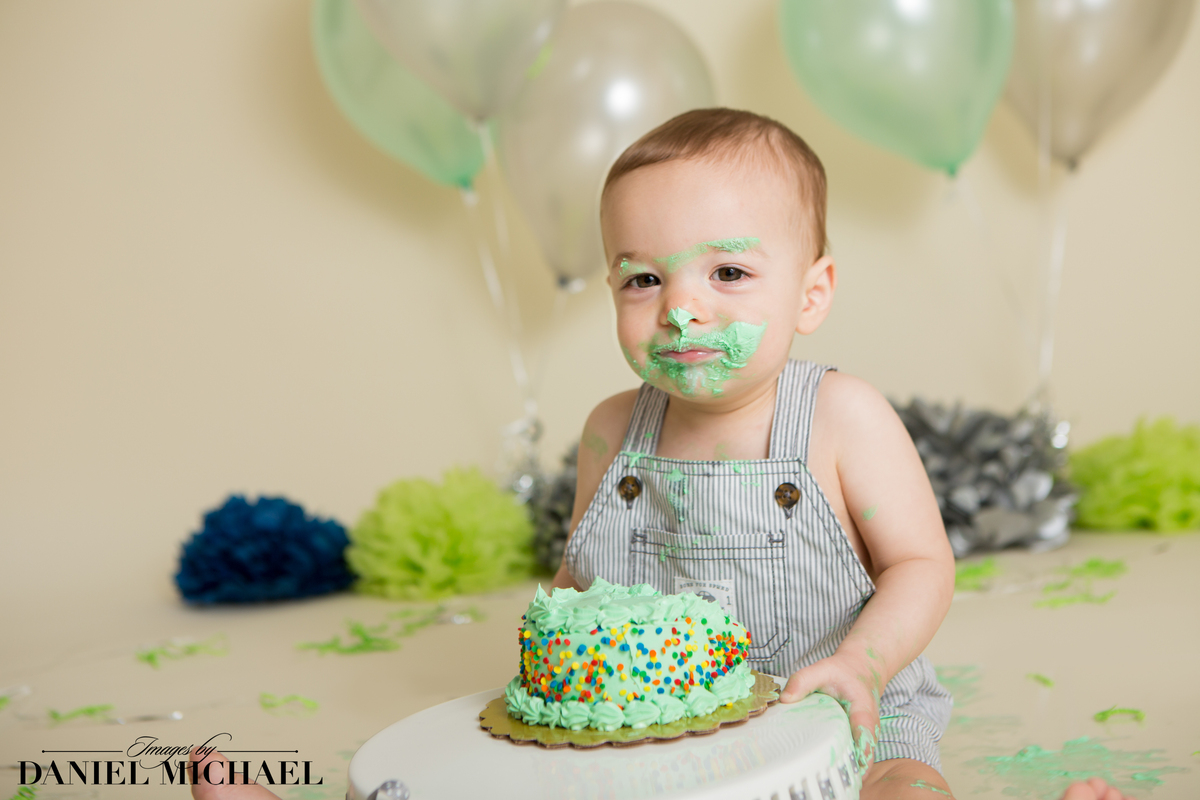 Kid with icing on his face from cake